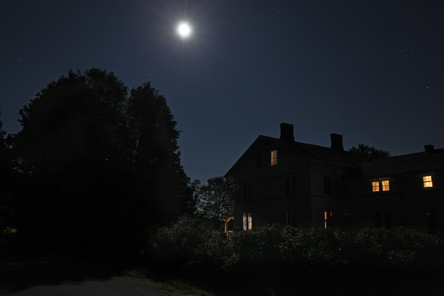 house and moon at night